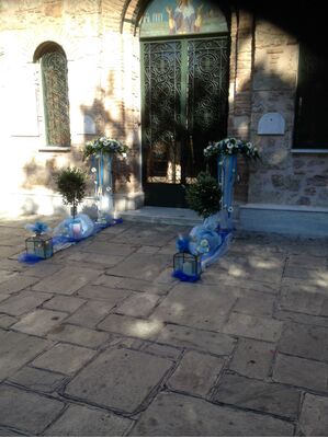 Arrow  shaped arrangements , Olive Plants (balls) and Candles