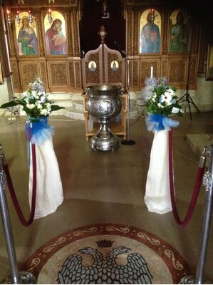 Arrow  shaped arrangements , Olive Plants (balls) and Candles