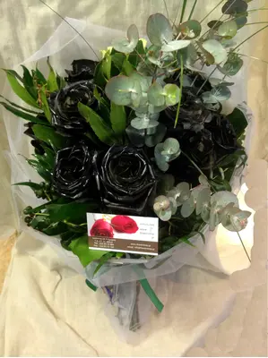 Roses black (9) stems arrangement in vase. Dyed.