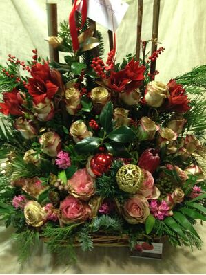 Ilex and pussy willow salix compined with season flowers in basket