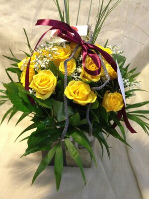 Season flowers bouquet in modern rectangular bag with water