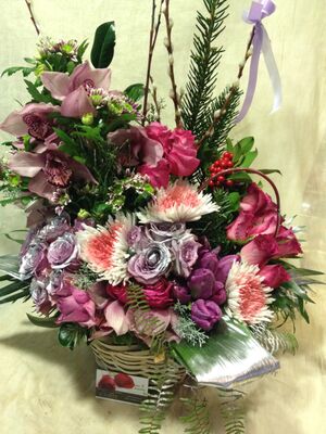 Christmas winter basket with elegant flowers.Exclusive.