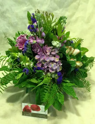 Arrangement in vase with decorative colored sand layers!!! Exclusive Flowers !!!
