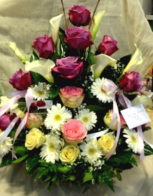 Basket flower arrangement for new born baby