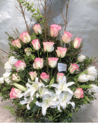 Basket with roses and cymbidium orchids