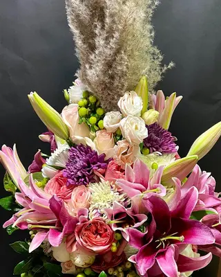 Exclusive arrangement in glass  vase. (flowers selected upon season and theme)