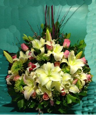 Basket arrangement  with pink season summer flowers