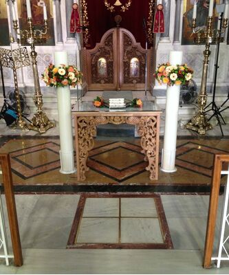 Wedding candles with wreaths of flowers