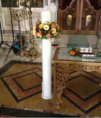 Wedding candles with wreaths of flowers