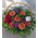Ανθοπωλεία.Σύνθεση σε καλάθι με πορτακαλί  λουλούδια εποχής