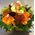 Flower arrangement in small ceramic "paper look" pot - orange colors.Exclusive.