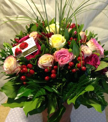 (21) orange - salmon  roses A' quality Dutch or Ecuador with greens gift wrapped.