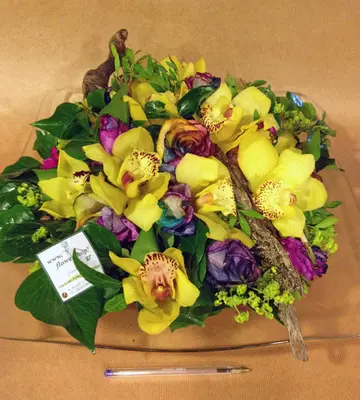 Table flower arrangement on glass tray. Rainbow surprise !!!