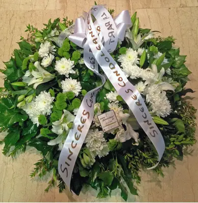 White & green condolences wreath.