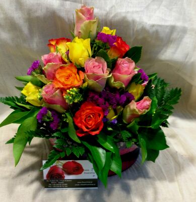 Mixed colored roses in glass. Small roses tower