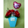Roses in colored glass vase
