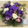 Arrangement with flowers and decoration in glass.