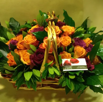 (41) orange - salmon  roses A' quality Dutch with greens in basket.