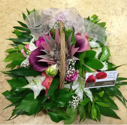 Small basket with blue colored sprayed roses arrangement.New Born Boy or Girl.(pink)