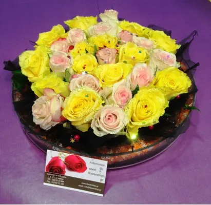 Mixed roses cake inside a glass cylinder jar
