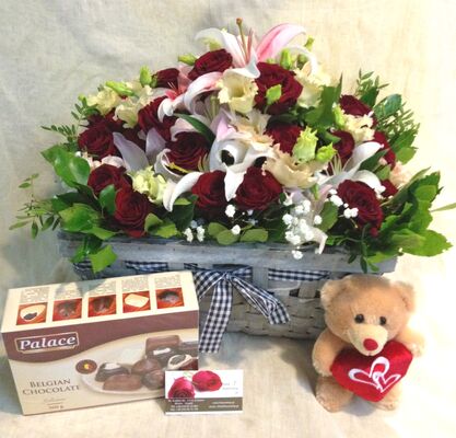 Exclusive arrangement with red roses (30)st. & Oriental Lillies + Chocolates + Teddy Bear.