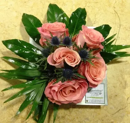 Arrangement with vanda orchids or roses in zink tray
