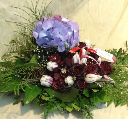 Flower arrangement on metal tray
