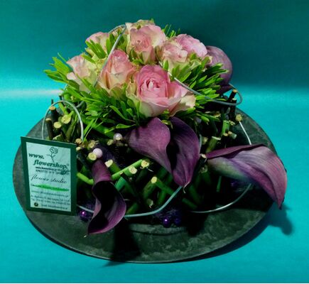 Flower arrangement on tray. Fence structure with rotating flowers !!!