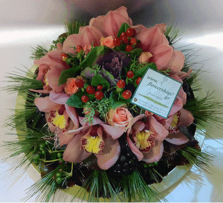 Cymbidium  orchids and roses on metal tray