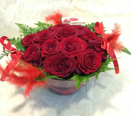 Red roses  A' quality Dutch inside quality glass vase.