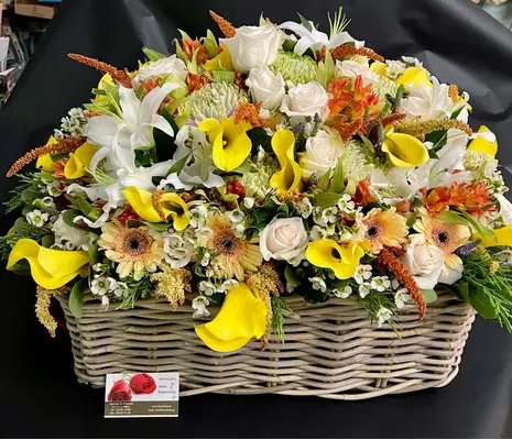 Flower Arrangement in wooden crane or basket. Exclusive.