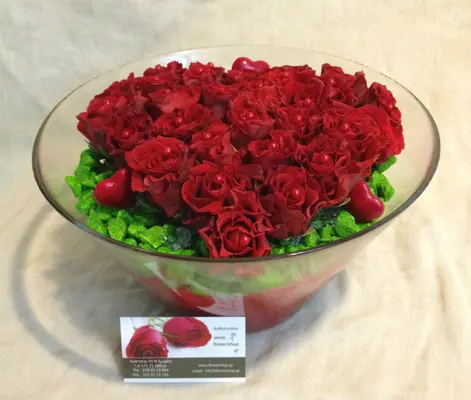 Red roses  A' quality Dutch inside quality glass vase.