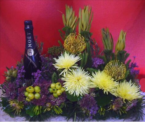Flower arrangement with champagne