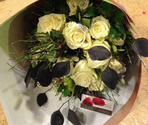 (21) white roses A' quality Dutch with greens gift wrapped.