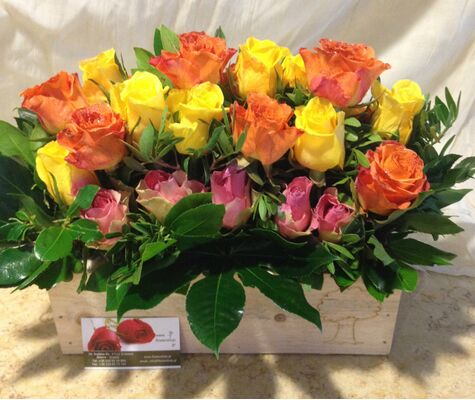 Mixed colored roses in wooden pot. (21) stems.