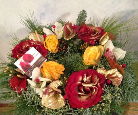 Christmas flowers in wreath basket