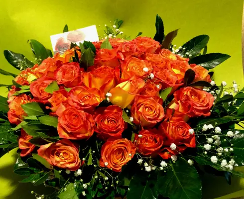 (50) orange - salmon  roses A' quality Dutch with greens in basket.