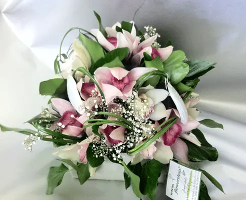 Arrangement with cymbidium orchids in "paper look" ceramic pot