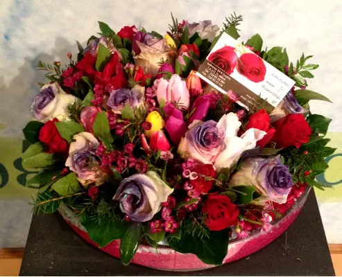 Arrangement in glass vase with white flowers