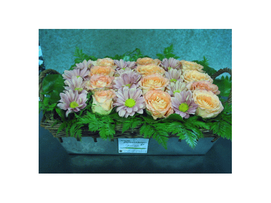 Basket arrangement with flowers in rows
