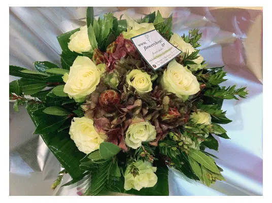Bouquet (12) white roses A' quality Dutch with greens gift wrapped.