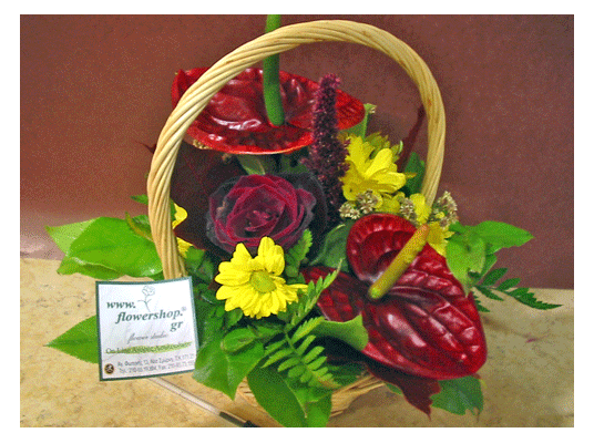 Flower arrangement in small  basket with autumn flavor