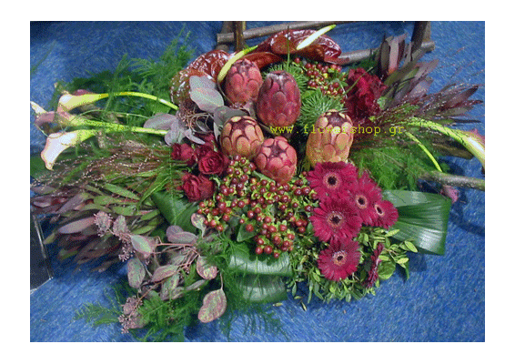 Condolences arrangement with exclusive tropical and seasonal flowers