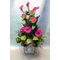 Flower arrangement in glass cube  vase