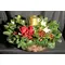 Christmas arrangement in basket with candle