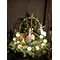Christmas arrangement in a basket with chocolates and drinks