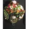 Artificial flower arrangement in big champagne glass