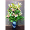 Flowers bouquet  in glass vase with decorative colored sand layers - Season flowers