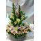 Flower arrangement in basket with season exclusive flowers
