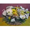 Flower arrangement in basket with Easter accessories